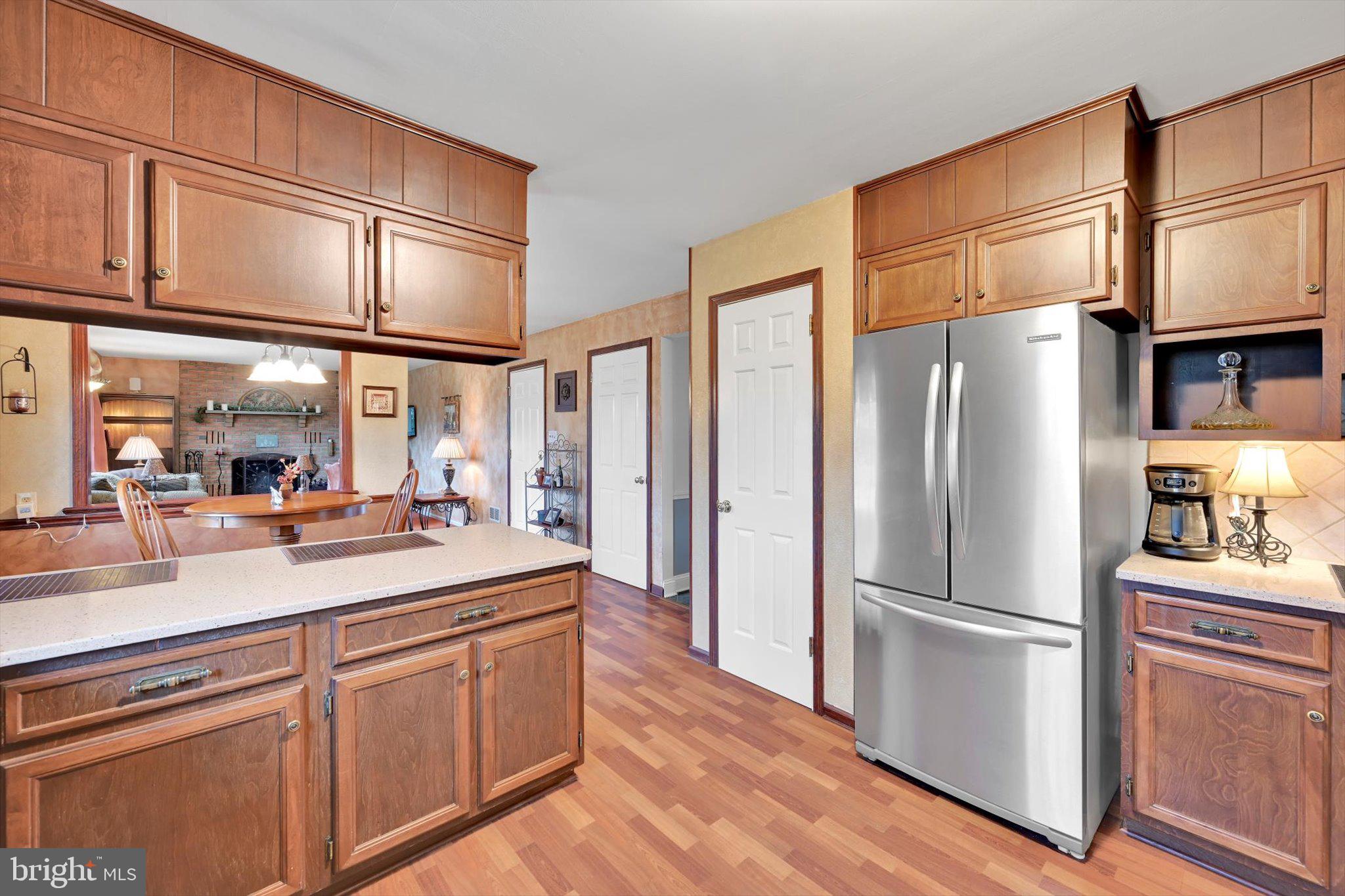 1546 Singer Road Wyomissing, PA 19610 - Photo 6 of 40 a kitchen with stainless steel appliances a refrigerator and cabinets