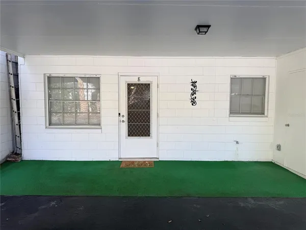 a view of house with backyard