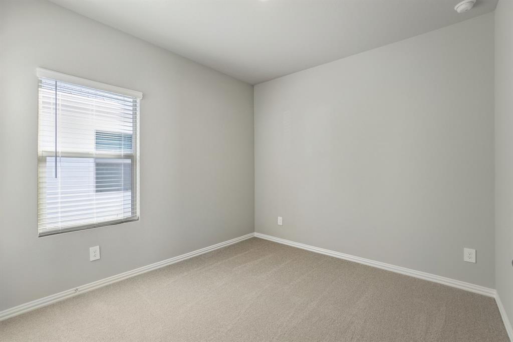 822 Sunflower Road Lavon, TX 75166 - Photo 21 of 38 an empty room with a window