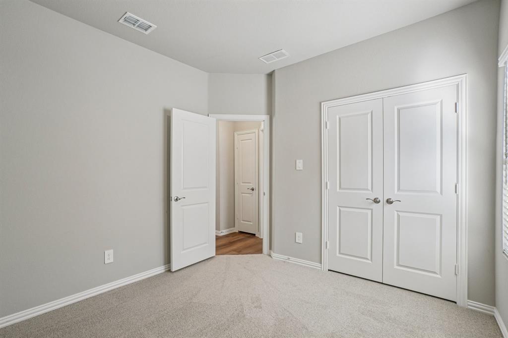 822 Sunflower Road Lavon, TX 75166 - Photo 22 of 38 an empty room with windows
