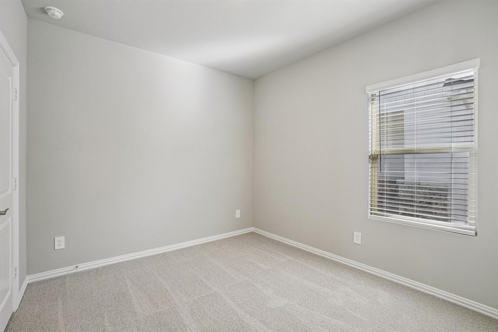 822 Sunflower Road Lavon, TX 75166 - Photo 23 of 38 an empty room with a window