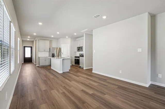 a view of kitchen with wooden floor
