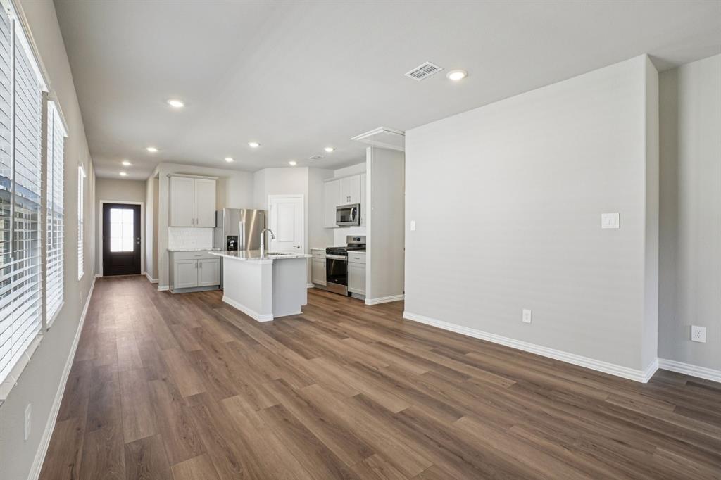 822 Sunflower Road Lavon, TX 75166 - Photo 7 of 38 a view of kitchen with wooden floor