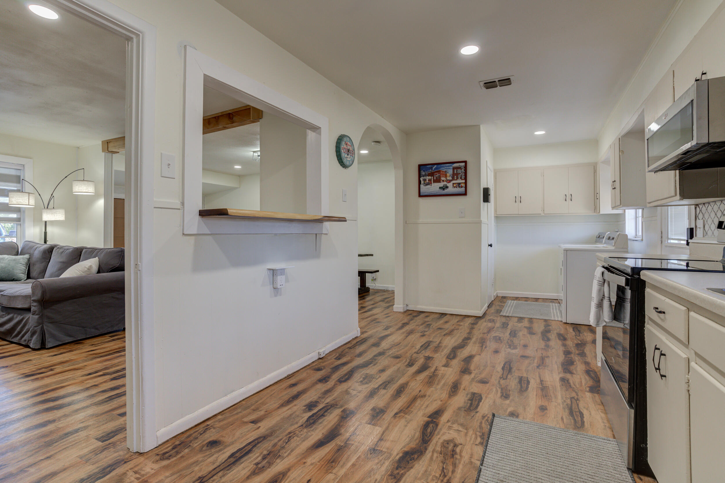 4609 Elgin Avenue Lubbock, TX 79413 - Photo 15 of 46 a view of a kitchen cabinets and wooden floor