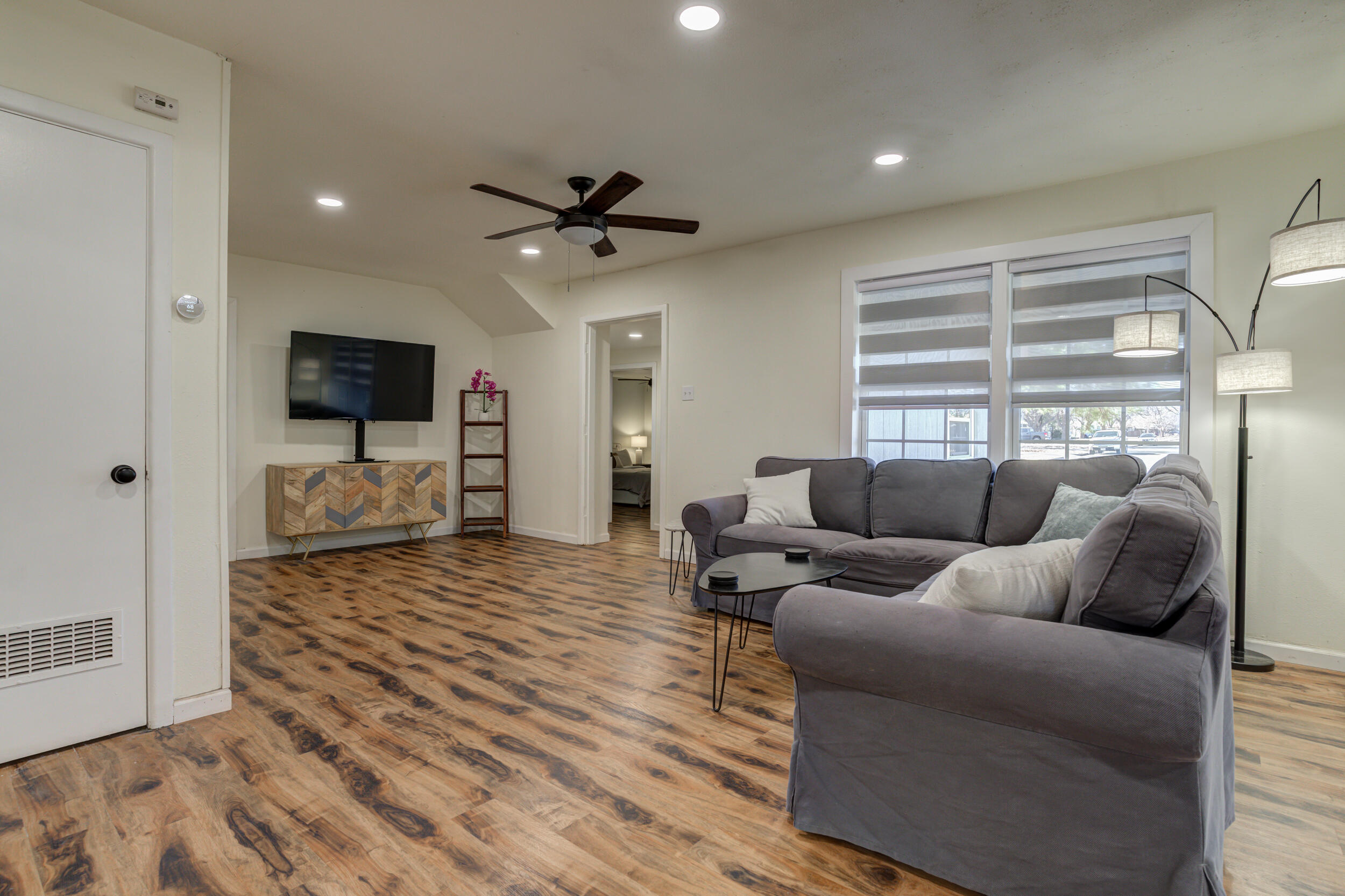 4609 Elgin Avenue Lubbock, TX 79413 - Photo 19 of 46 a living room with furniture and a flat screen tv