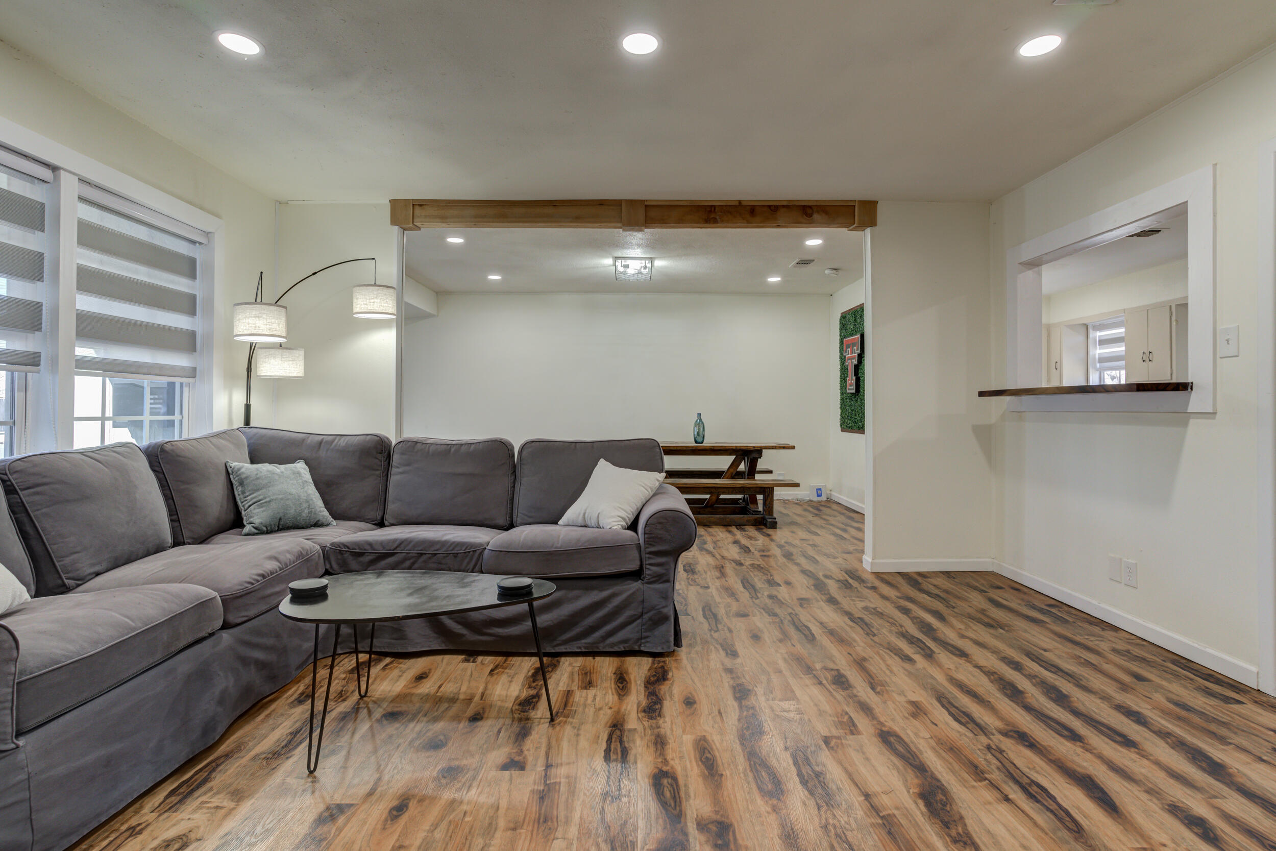 4609 Elgin Avenue Lubbock, TX 79413 - Photo 21 of 46 a living room with furniture and a wooden floor