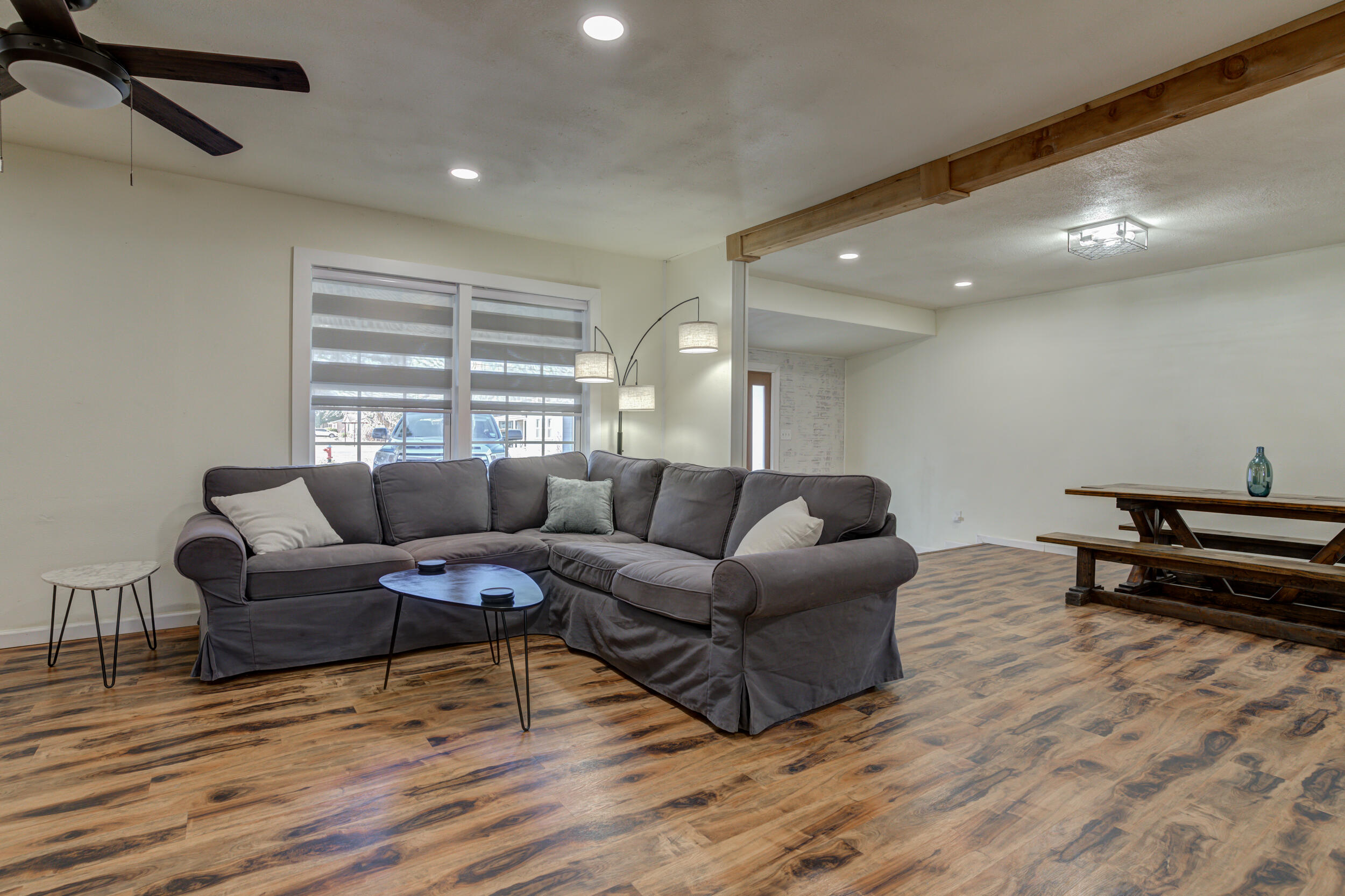 4609 Elgin Avenue Lubbock, TX 79413 - Photo 22 of 46 a living room with furniture and a wooden floor