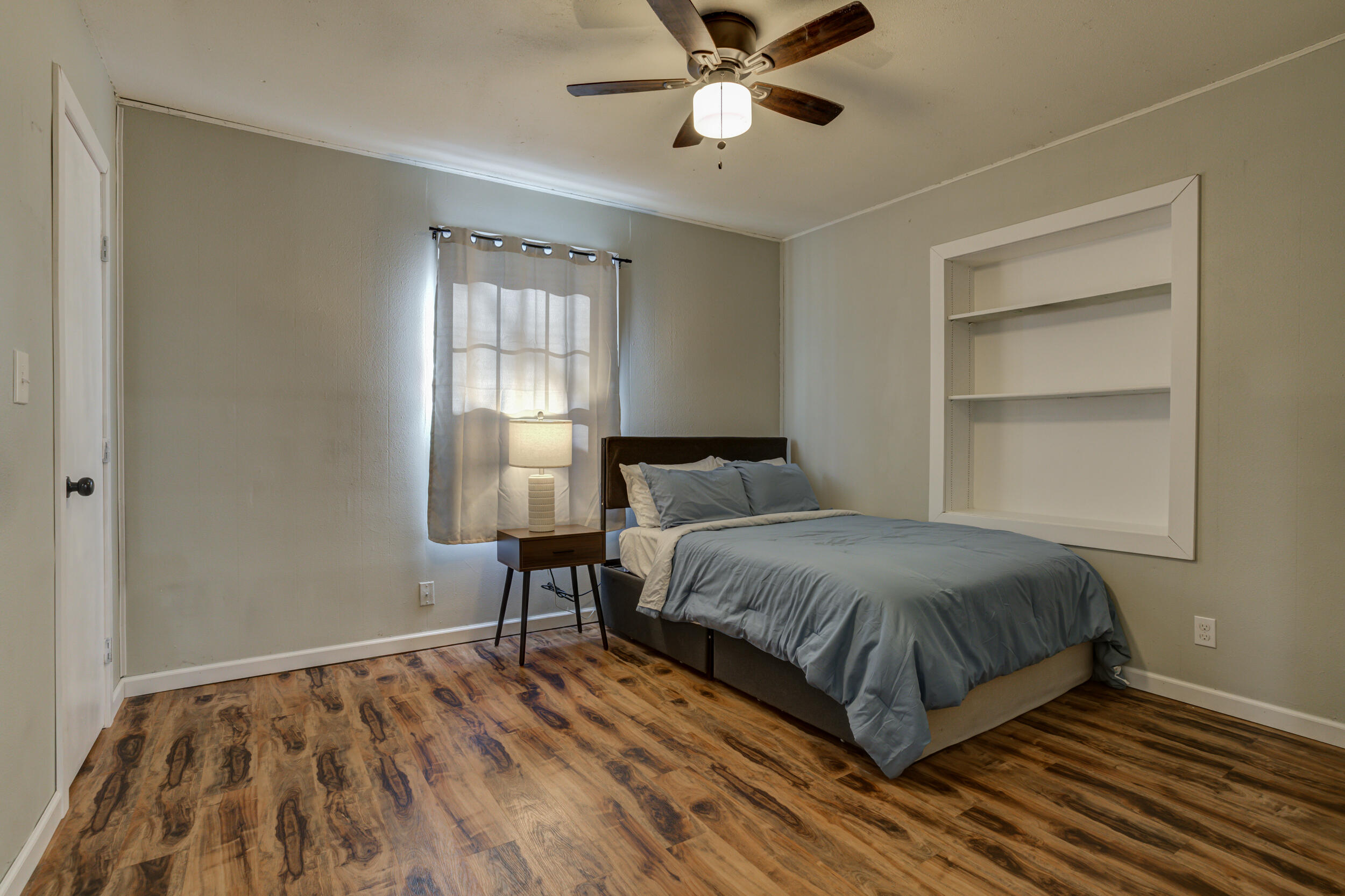 4609 Elgin Avenue Lubbock, TX 79413 - Photo 25 of 46 a bedroom with a bed and a window