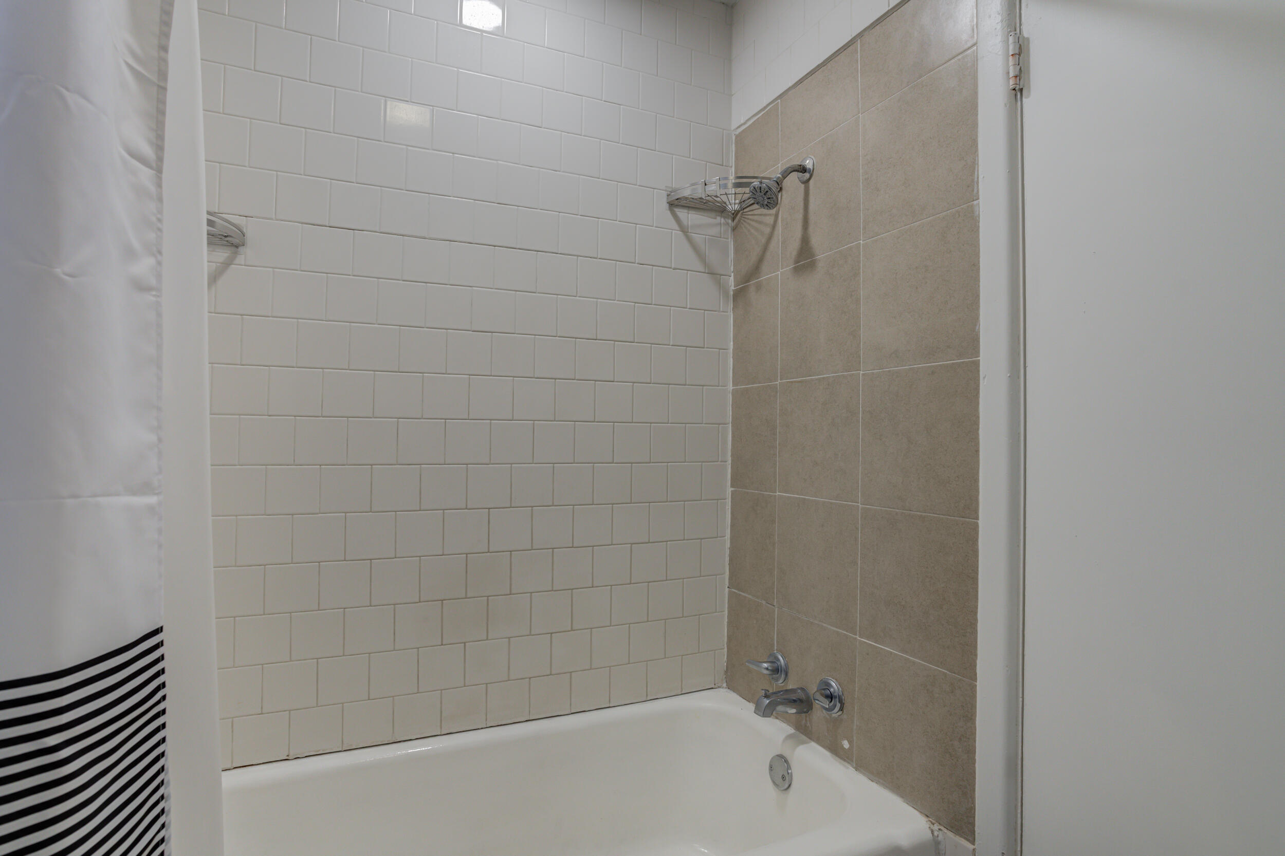 4609 Elgin Avenue Lubbock, TX 79413 - Photo 28 of 46 a bathroom with a bathtub