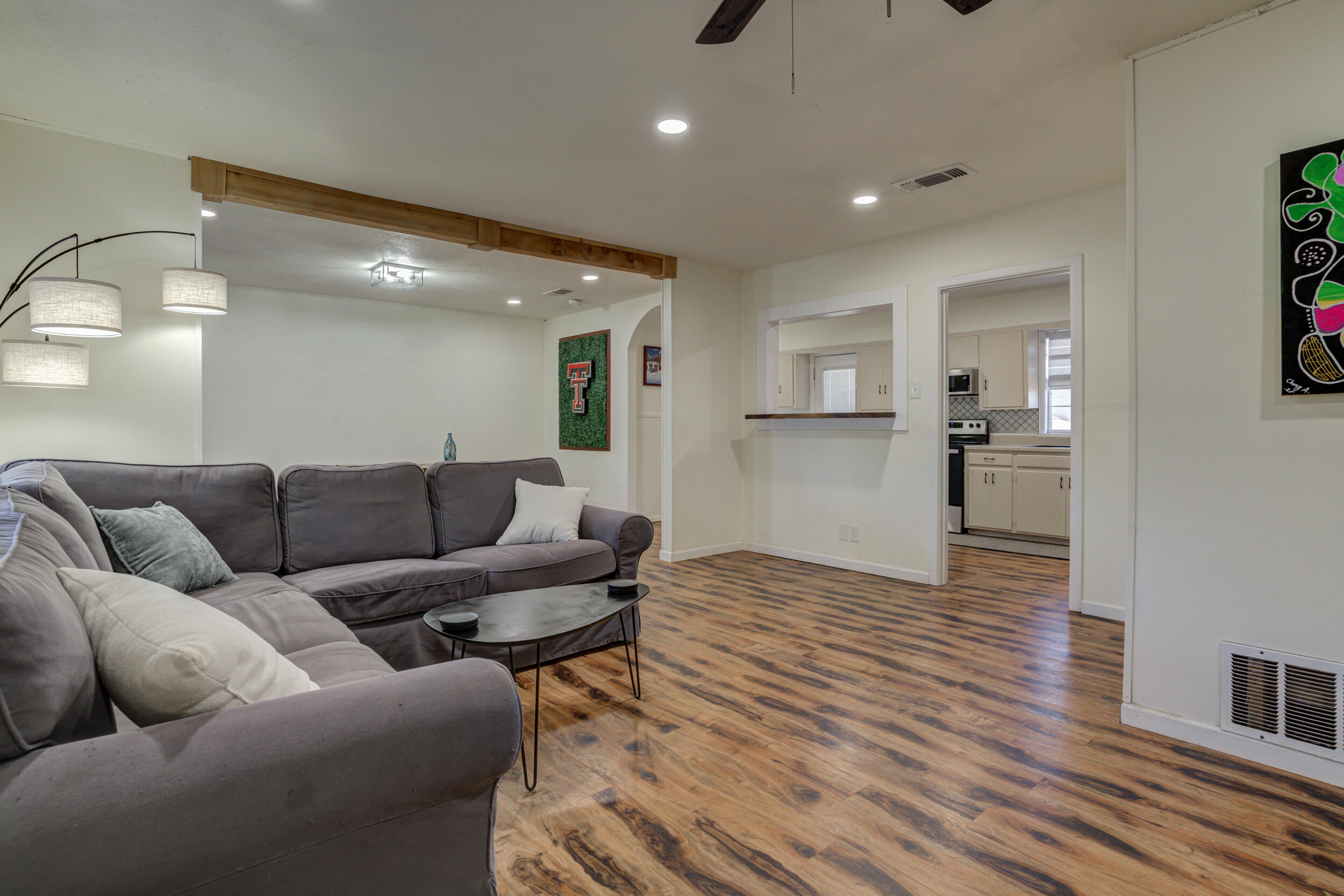 4609 Elgin Avenue Lubbock, TX 79413 - Photo 4 of 46 a living room with furniture and kitchen view