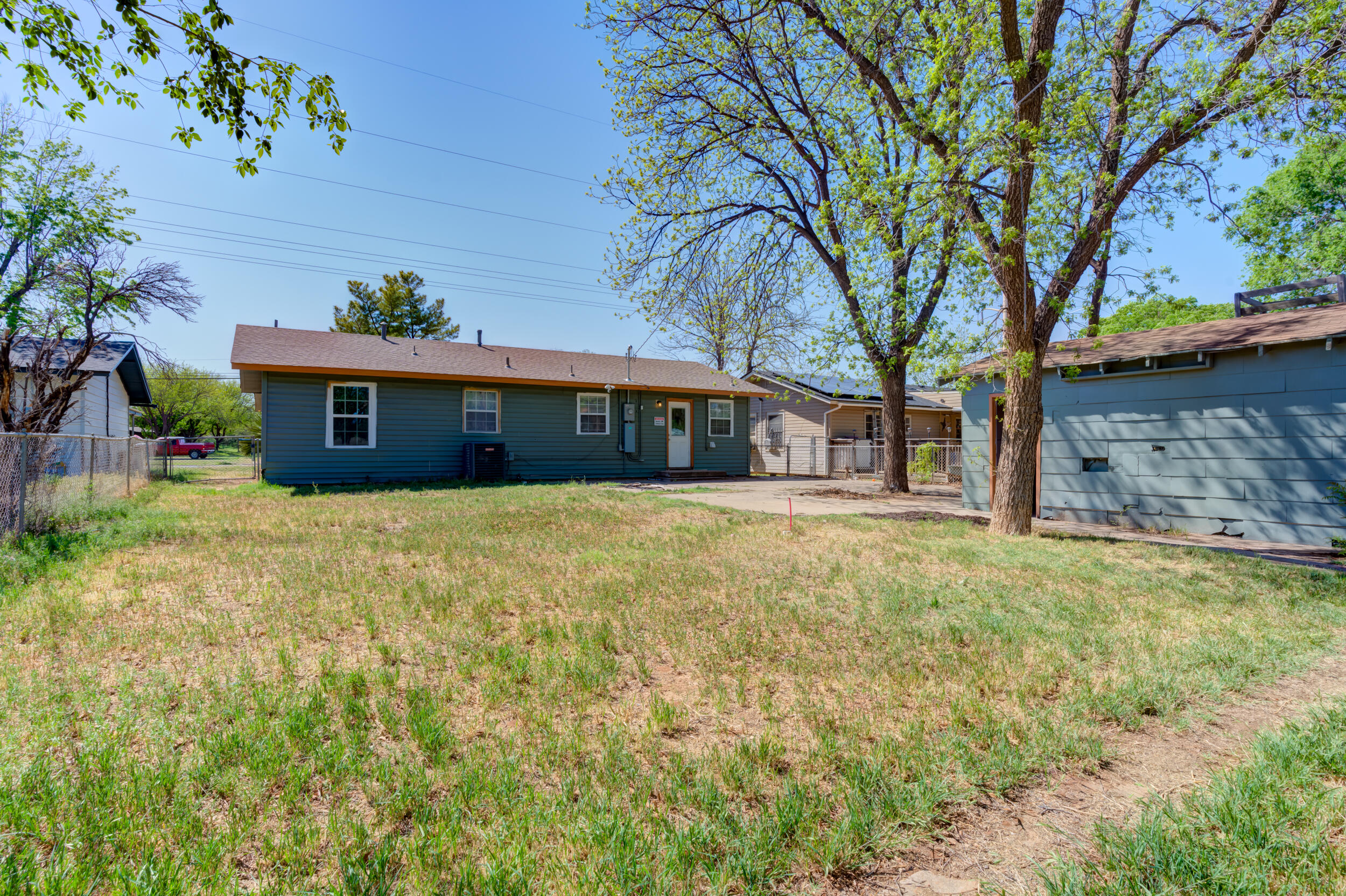 4609 Elgin Avenue Lubbock, TX 79413 - Photo 41 of 46 a front view of a house with a garden