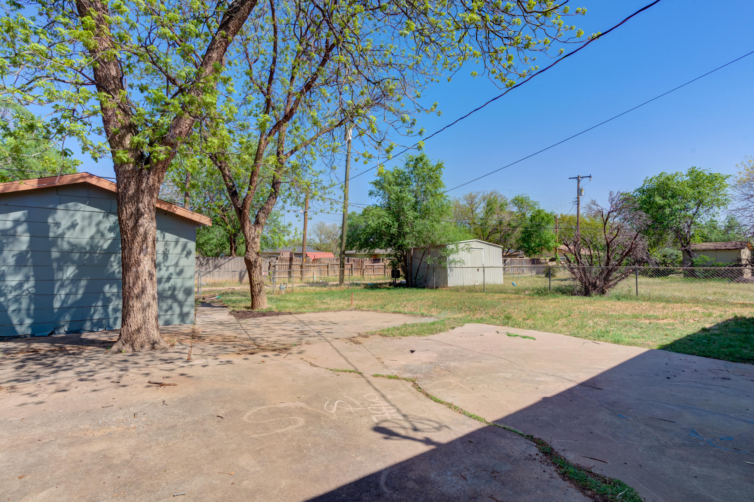 4609 Elgin Avenue Lubbock, TX 79413 - Photo 46 of 46 a view of a yard with plants and trees