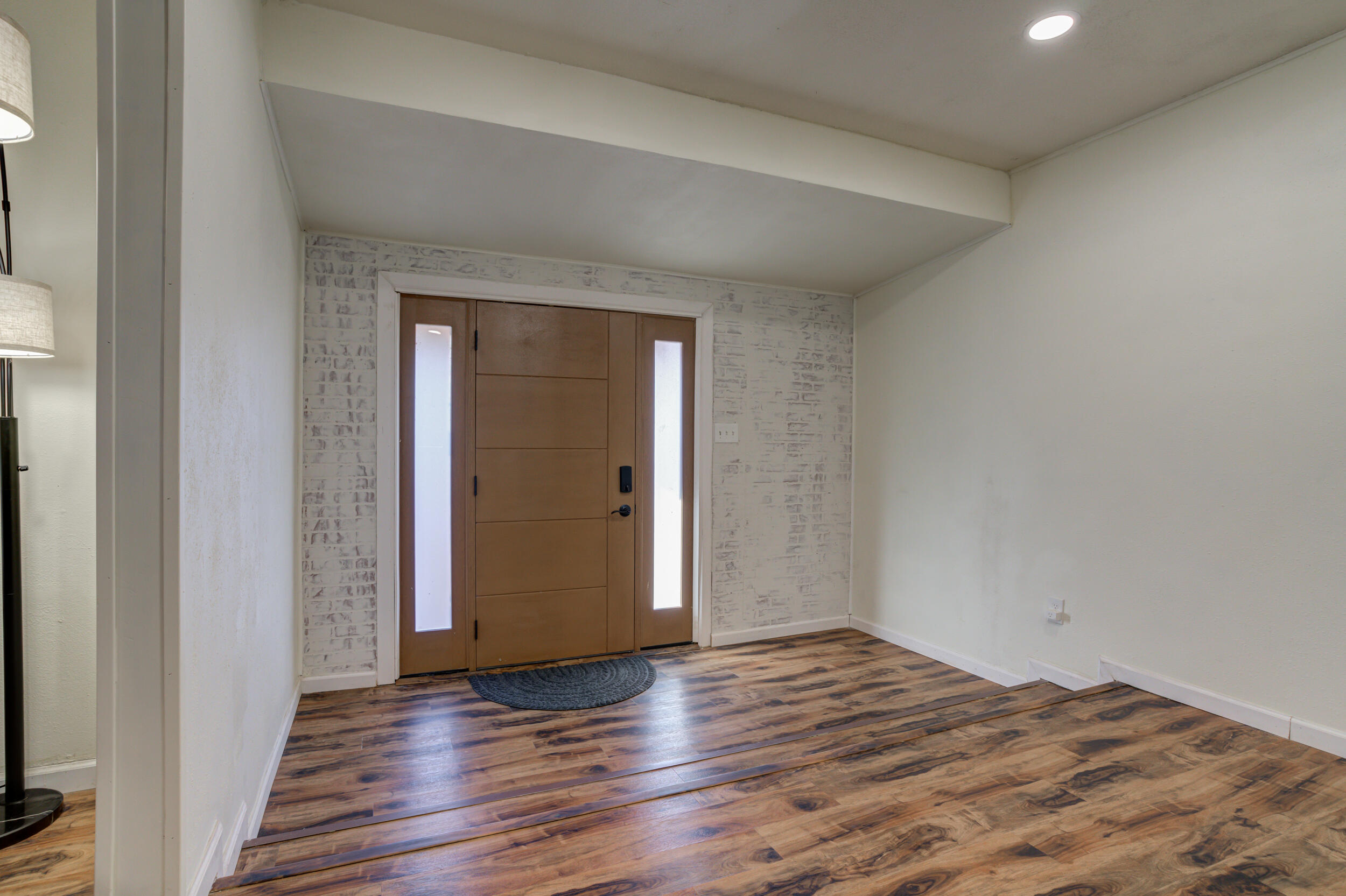 4609 Elgin Avenue Lubbock, TX 79413 - Photo 7 of 46 a view of empty room with wooden floor