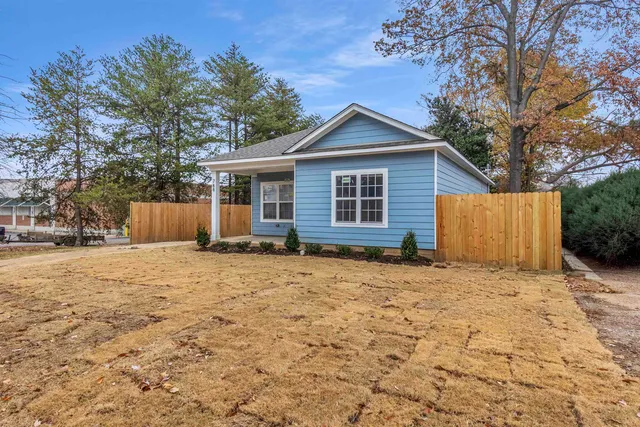 a house with trees in the background