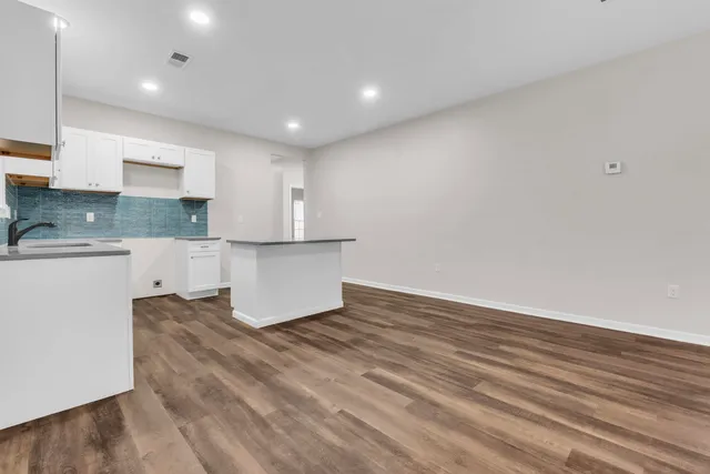 a view of kitchen with wooden floor