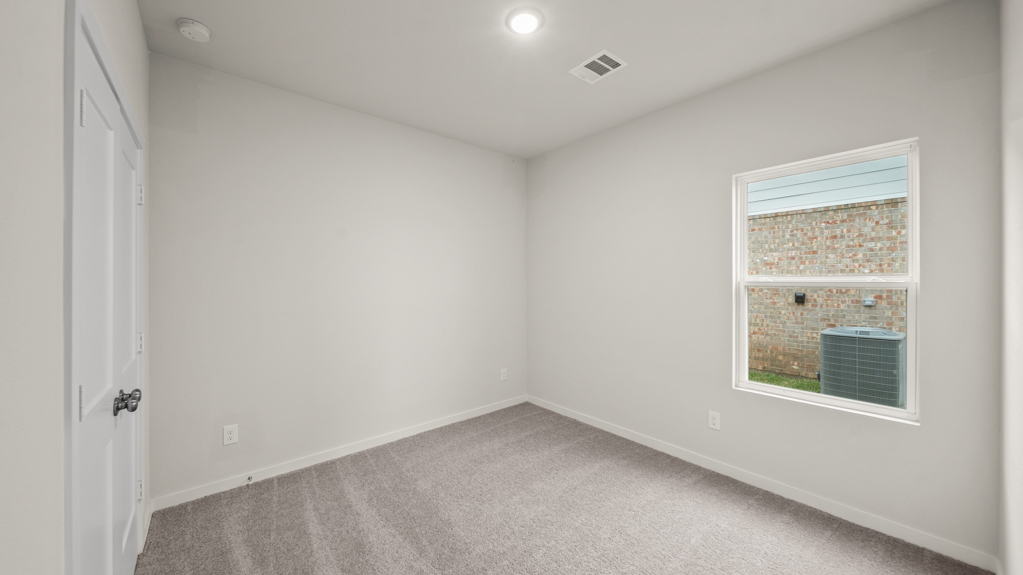 26051 Spiney Thistle Road Katy, TX 77493 - Photo 16 of 22 an empty room with a window