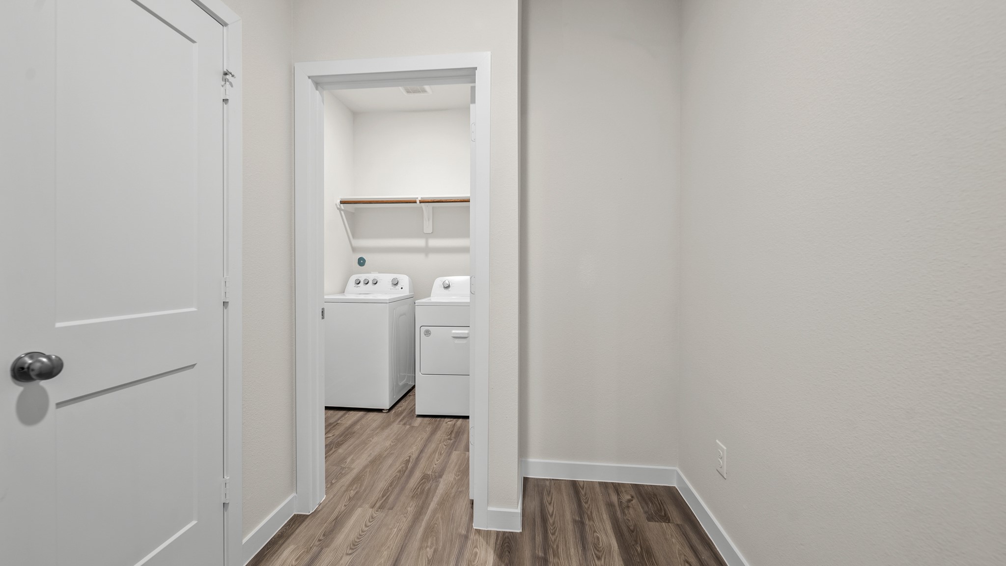 26051 Spiney Thistle Road Katy, TX 77493 - Photo 18 of 22 a view of walk in closet with wooden floor