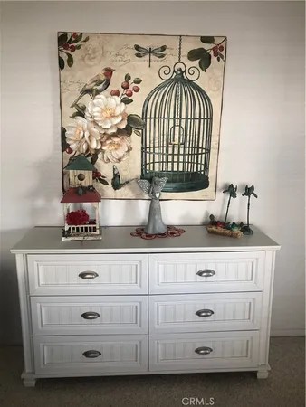 a view of white cabinets with a sink