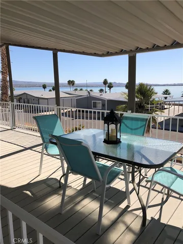 a view of a chairs and table in the patio
