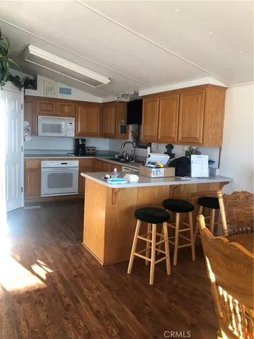 a kitchen with a sink cabinets and window