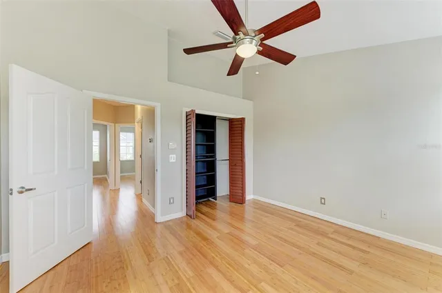 a view of a room with a window and ceiling fan