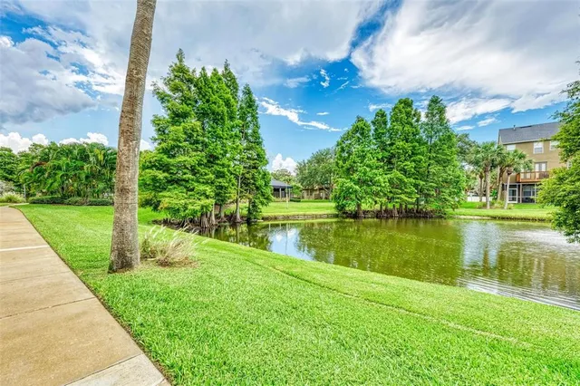 a view of a lake with a yard