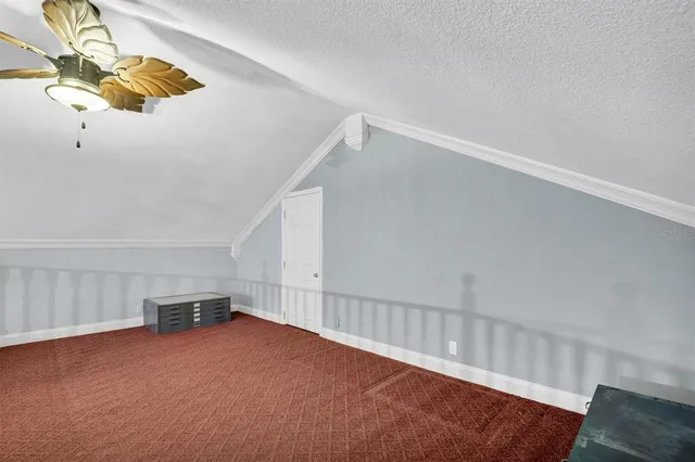 a spacious bathroom with a tub sink and mirror
