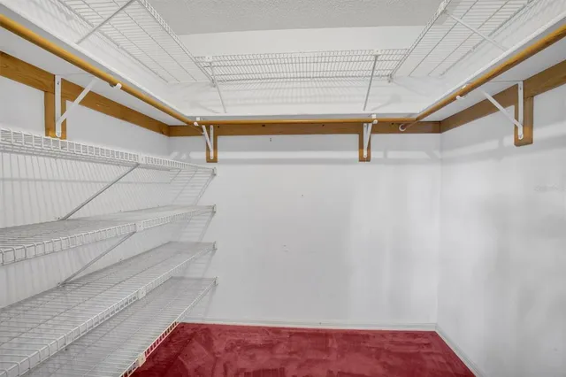 a view of an empty room with windows