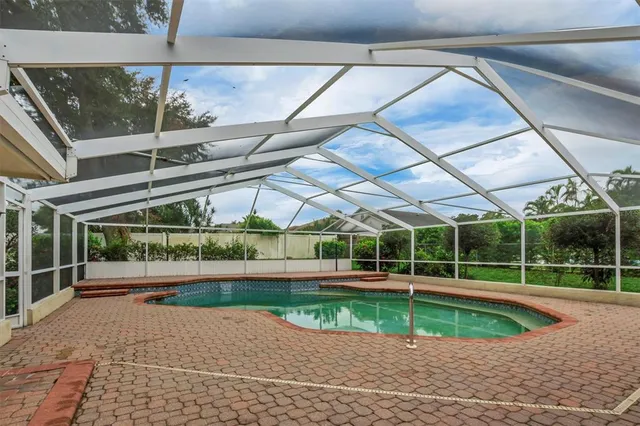 an aerial view of lake residential house with outdoor space and lake view