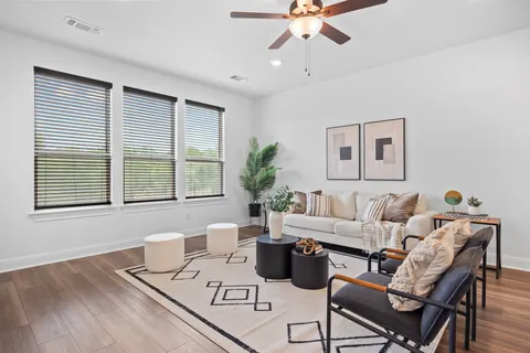 a living room with furniture and a window