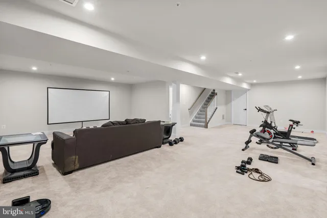 a bedroom with furniture and a flat screen tv