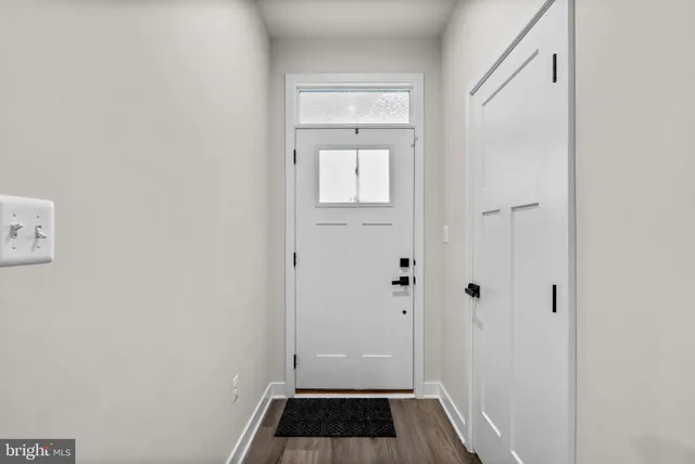 a view of bathroom with a sink and a mirror