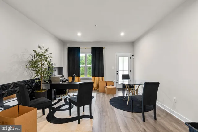 a view of a dining room with furniture and window