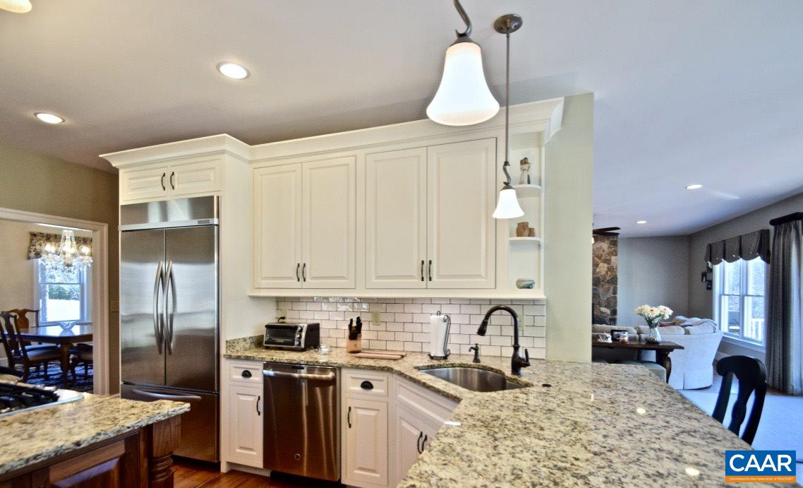 2852 Milton Road Charlottesville, VA 22902 - Photo 12 of 49 a kitchen with stainless steel appliances granite countertop a stove a sink dishwasher a refrigerator and cabinets with wooden floor