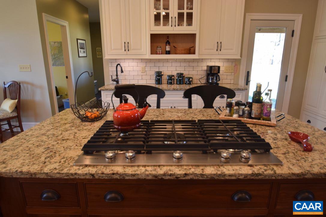 2852 Milton Road Charlottesville, VA 22902 - Photo 13 of 49 a kitchen with a stove and cabinets