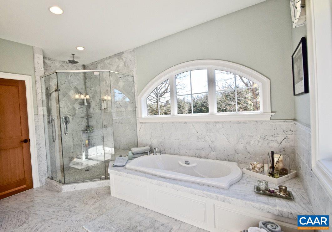 2852 Milton Road Charlottesville, VA 22902 - Photo 19 of 49 a bathroom with a tub sink mirror and a bathtub