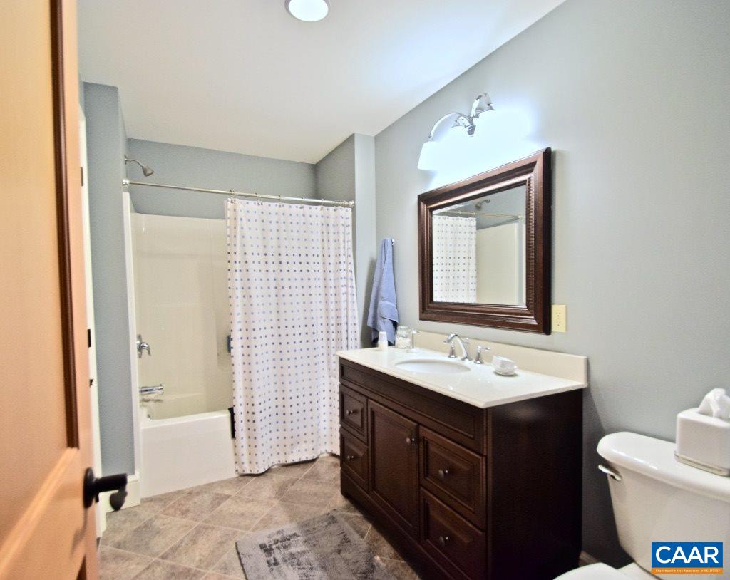 2852 Milton Road Charlottesville, VA 22902 - Photo 30 of 49 a bathroom with a sink vanity mirror and toilet