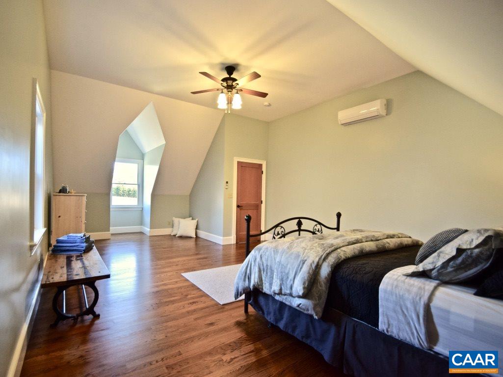 2852 Milton Road Charlottesville, VA 22902 - Photo 31 of 49 a bedroom with a bed and wooden floor
