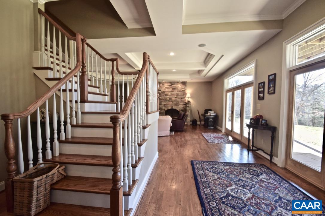 2852 Milton Road Charlottesville, VA 22902 - Photo 33 of 49 a living room with wooden floor and a rug