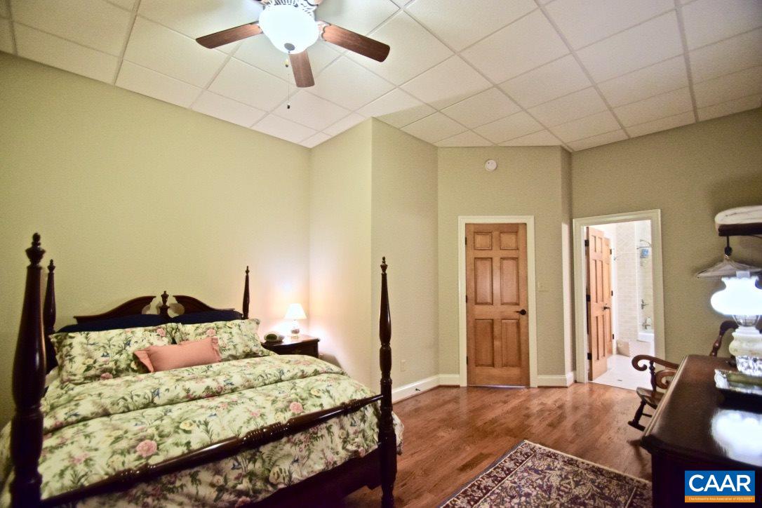 2852 Milton Road Charlottesville, VA 22902 - Photo 36 of 49 a bedroom with a bed and a chandelier