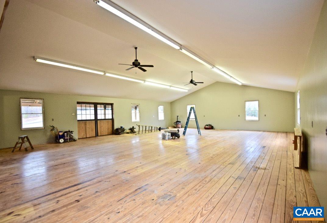 2852 Milton Road Charlottesville, VA 22902 - Photo 42 of 49 a view of a livingroom with a flat screen tv and wooden floor