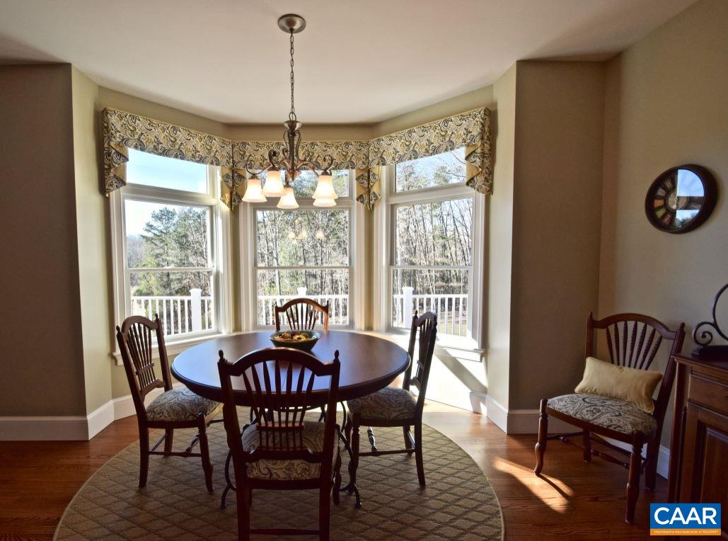 2852 Milton Road Charlottesville, VA 22902 - Photo 8 of 49 a view of a dining room with furniture window and wooden floor