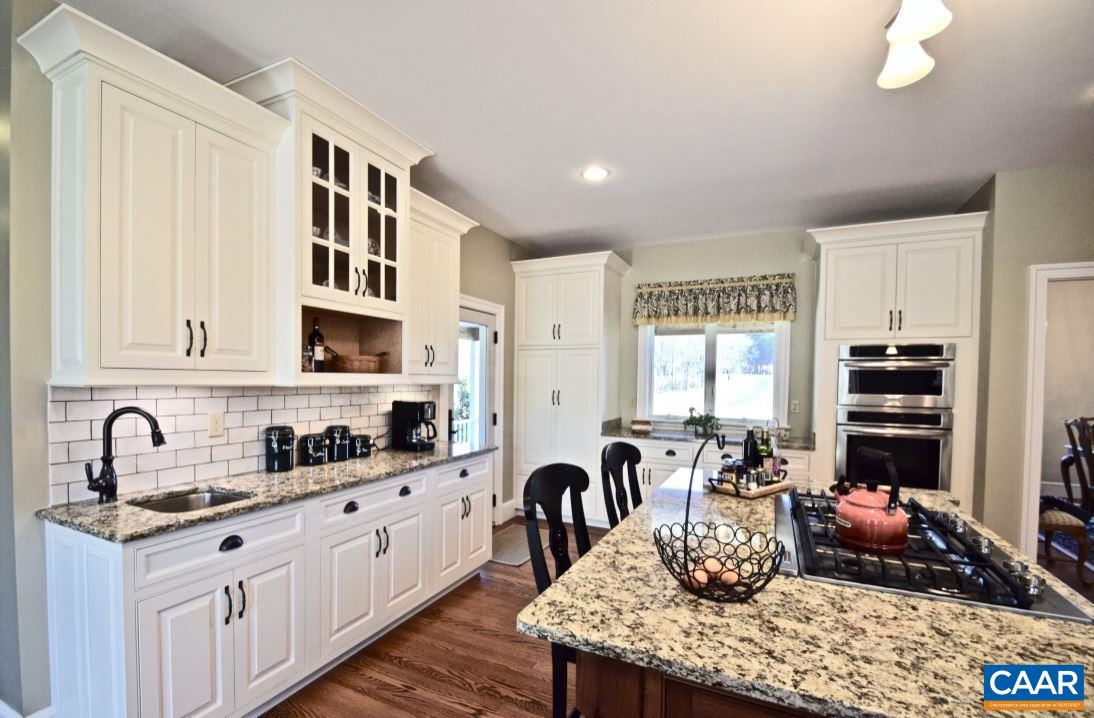 2852 Milton Road Charlottesville, VA 22902 - Photo 10 of 49 a kitchen with stainless steel appliances kitchen island granite countertop a sink and cabinets
