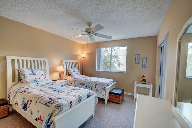 a bedroom with a bed furniture and a window