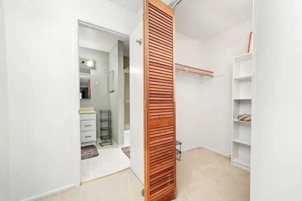 a view of a bedroom with closet