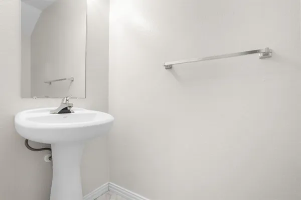 a bathroom with a sink and mirror