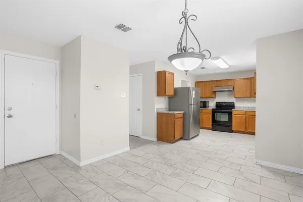 a view of a kitchen with a sink and cabinets