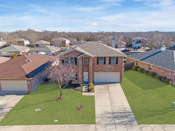 an aerial view of a house with a garden
