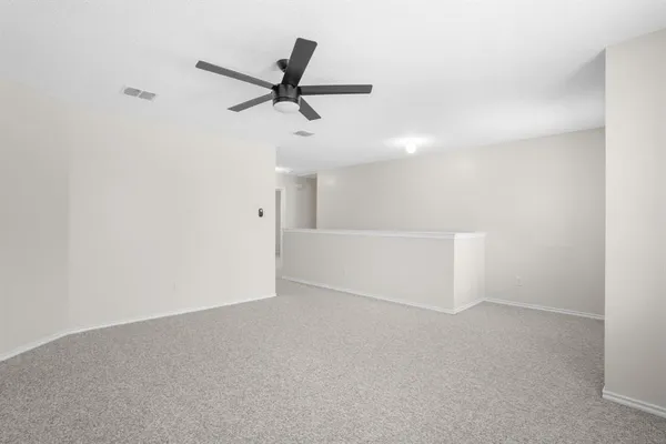 a view of a big room with carpet