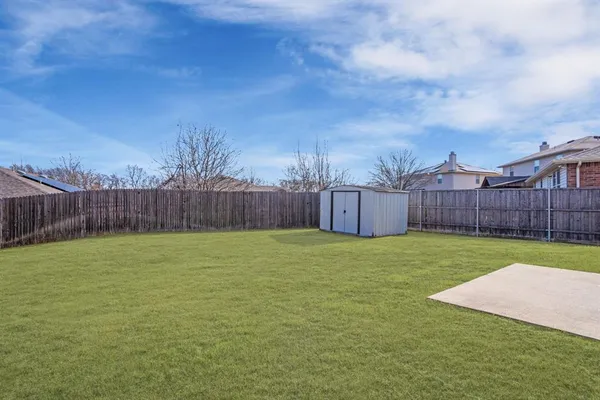 a view of a backyard with green space